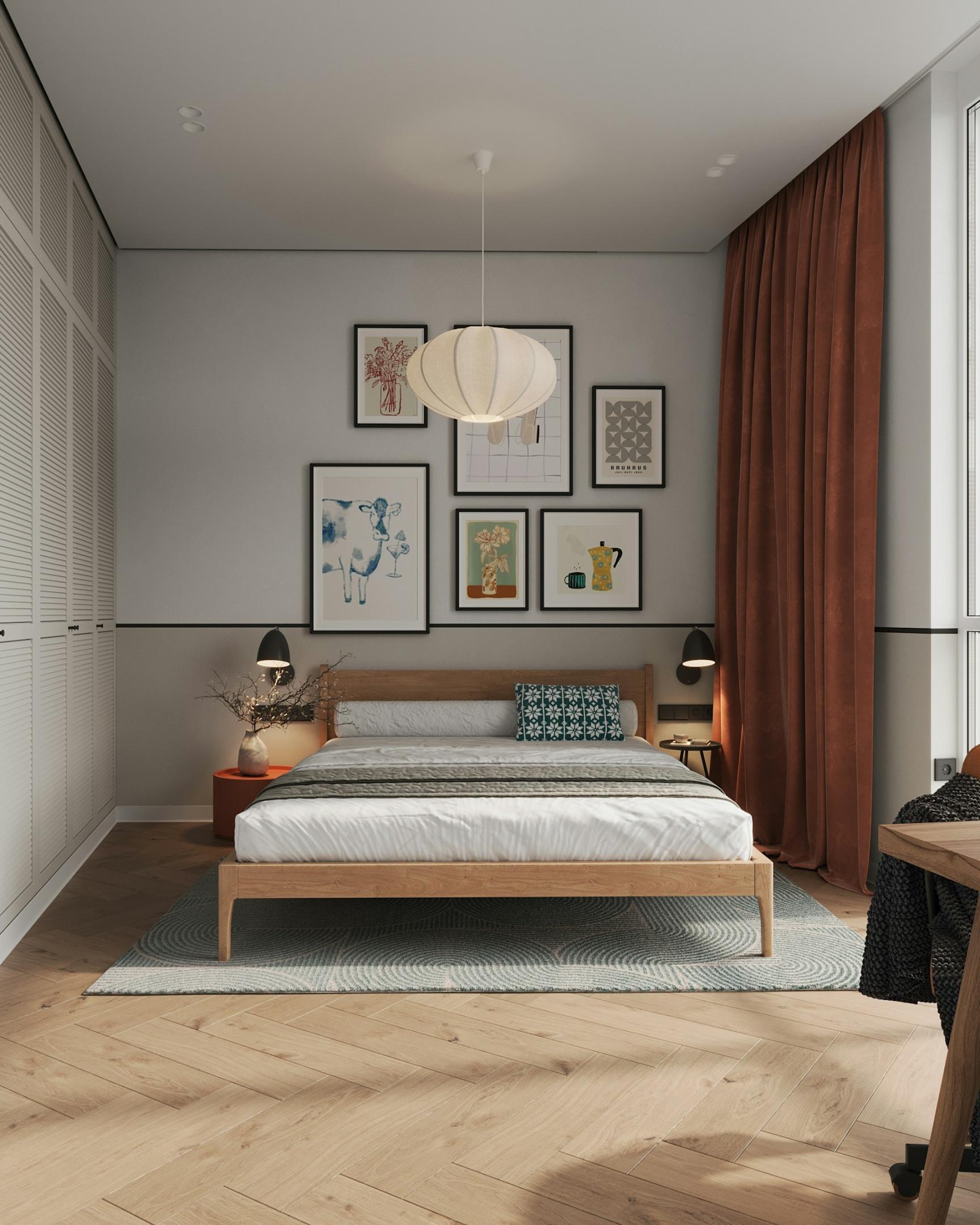 Bedroom with frames on the wall and brown curtain